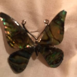 Vintage abalone colored butterfly brooch with a silver back.